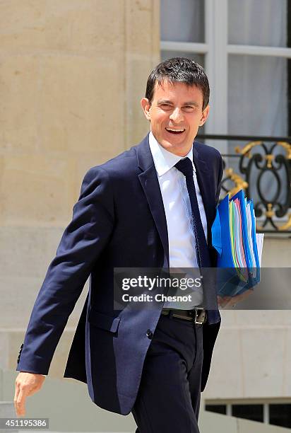 French Prime minister, Manuel Valls, leaves after a cabinet meeting at the Elysee Palace on June 25, 2014 in Paris, France.