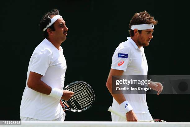 Purav Raja of India and Marcelo Demoliner of Brazil during their Gentlemen's Doubles first round match against Juan-Sebastian Cabal of Colombia and...