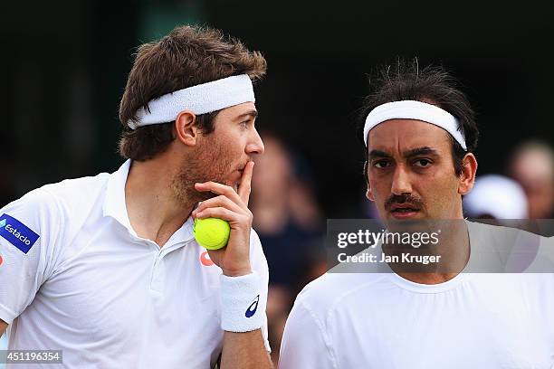 Purav Raja of India and Marcelo Demoliner of Brazil during their Gentlemen's Doubles first round match against Juan-Sebastian Cabal of Colombia and...