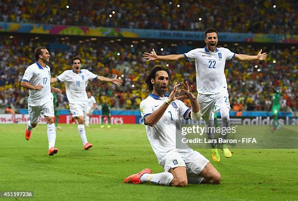 Giorgos Samaras of Greece celebrates scoring his team's second goal from the penalty spot with team mates during the 2014 FIFA World Cup Brazil Group...