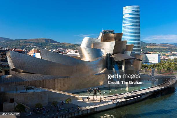 Frank Gehry's Guggenheim Museum, The Spider sculpture, Iberdrola Tower and River Nervion at Bilbao, Spain