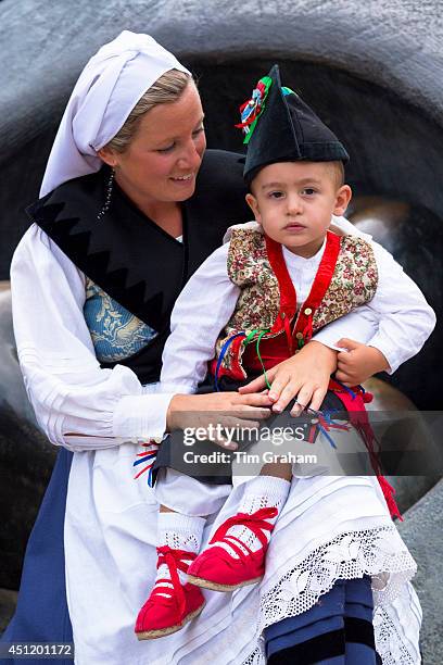 Mother and child at raditional fiesta at Villaviciosa in Asturias, Northern Spain