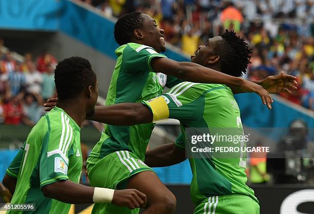 Nigeria's forward Ahmed Musa celebrates his goal with Nigeria's defender Joseph Yobo during a Group F football match between Nigeria and Argentina at...