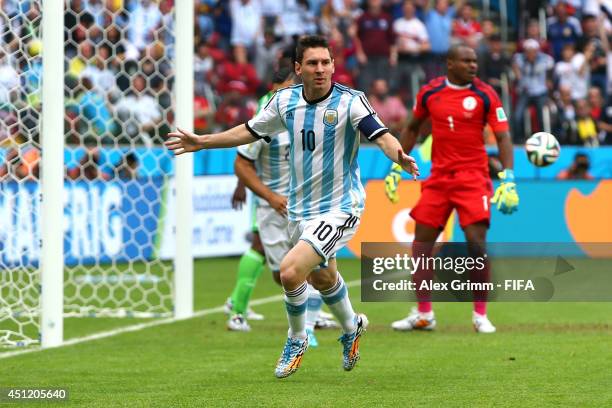 Lionel Messi of Argentina celebrates scoring his team's first goal during the 2014 FIFA World Cup Brazil Group F match between Nigeria and Argentina...