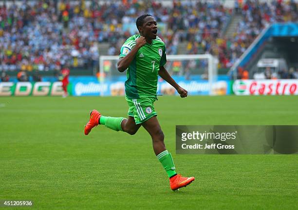 Ahmed Musa of Nigeria celebrates scoring his team's first goal during the 2014 FIFA World Cup Brazil Group F match between Nigeria and Argentina at...