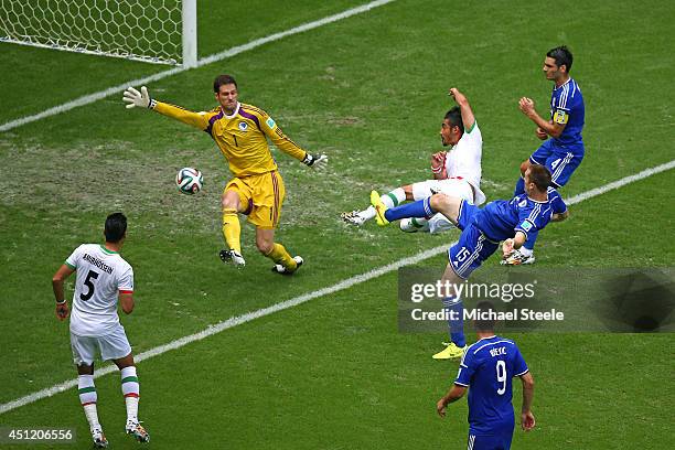 Reza Ghoochannejhad of Iran attempts a shot at goal during the 2014 FIFA World Cup Brazil Group F match between Bosnia and Herzegovina and Iran at...