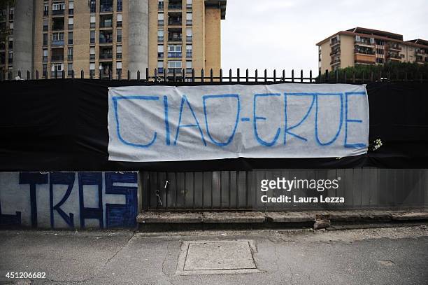 Banner that reads 'Ciao eroe' dedicated to Napoli fan Ciro Esposito who died this morning is displayed outside the car wash where he worked on June...