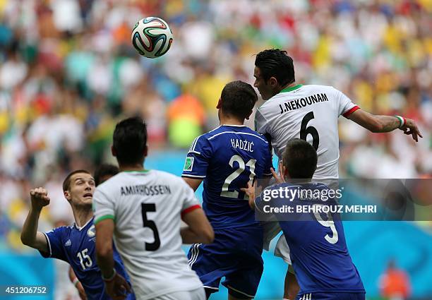Bosnia-Herzegovina's defender Toni Sunjic , Iran's defender Amir Hossein Sadeghi , Bosnia-Herzegovina's midfielder Anel Hadzic , Bosnia-Herzegovina's...
