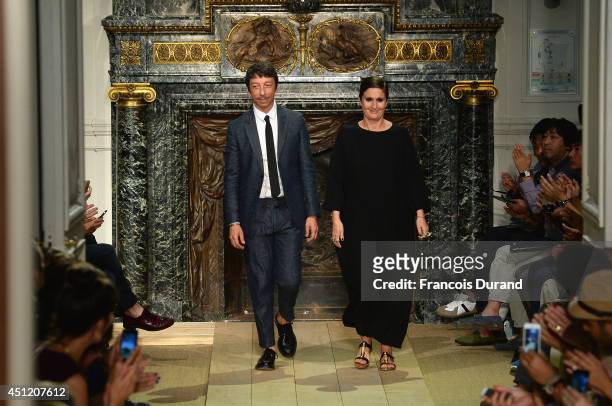 Pier Paolo Piccioli and Maria Grazia Chiuri acknowledge the applause of the audience at the end of the Valentino show as part of the Paris Fashion...