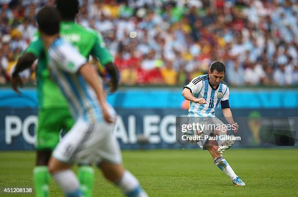 Lionel Messi of Argentina scores his team's second goal and his second of the game during the 2014 FIFA World Cup Brazil Group F match between...