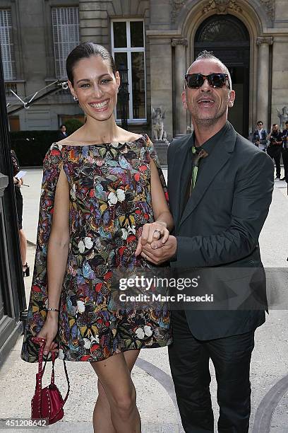 Singer Eros Ramazzotti and wife Marica Pellegrinelli arrive to attend the 'Valentino' Menswear Spring/Summer 2015 on June 25, 2014 in Paris, France.