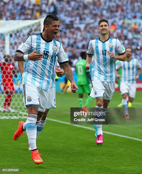 Marcos Rojo of Argentina celebrates scoring his team's third goal during the 2014 FIFA World Cup Brazil Group F match between Nigeria and Argentina...