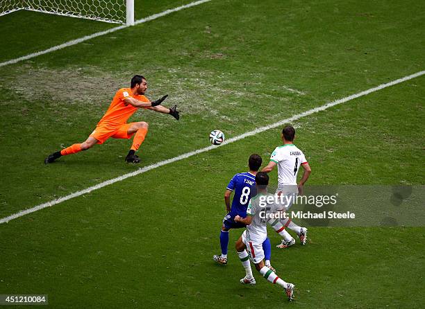 Miralem Pjanic of Bosnia and Herzegovina shoots and scores his team's second goal past goalkeeper Alireza Haghighi of Iran during the 2014 FIFA World...