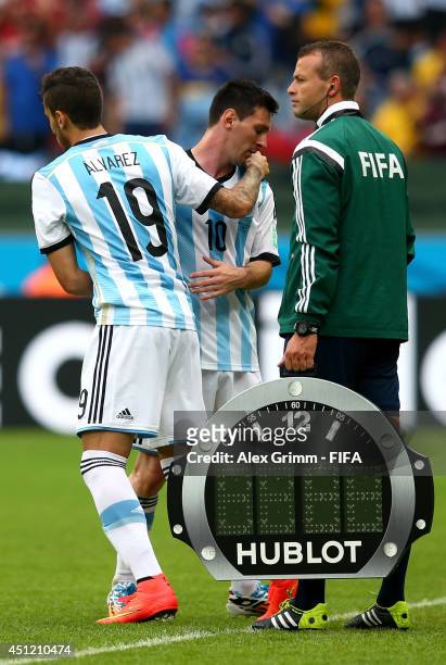 Lionel Messi of Argentina hugs with Ricardo Alvarez of Argentina as he is replaced during the 2014 FIFA World Cup Brazil Group F match between...