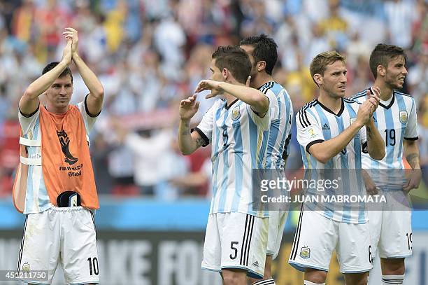 Argentina's forward Lionel Messi, midfielder Fernando Gago, defender Ezequiel Garay, midfielder Lucas Biglia and midfielder Ricky Alvarez celebrate...