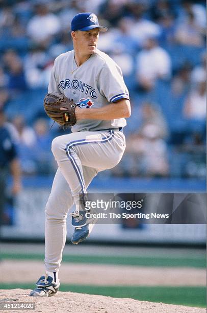Mike Timlin of the Toronto Blue Jays pitches against the Chicago White Sox at Comiskey Park in Chicago, Illinois on August 25, 1996. The White Sox...