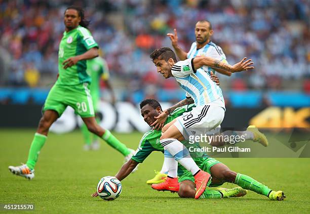 Ricardo Alvarez of Argentina competes for the ball with John Obi Mikel of Nigeria during the 2014 FIFA World Cup Brazil Group F match between Nigeria...