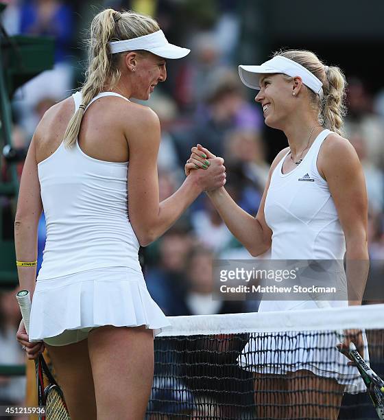 Naomi Broady of Great Britain shakes hands with Caroline Wozniacki of Denmark after their Ladies' Singles second round match on day three of the...
