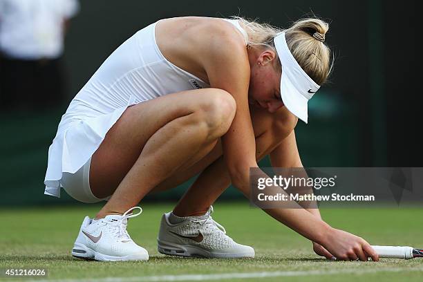 Naomi Broady of Great Britain is dejected during her defeat in her Ladies' Singles second round match against Caroline Wozniacki of Denmark on day...