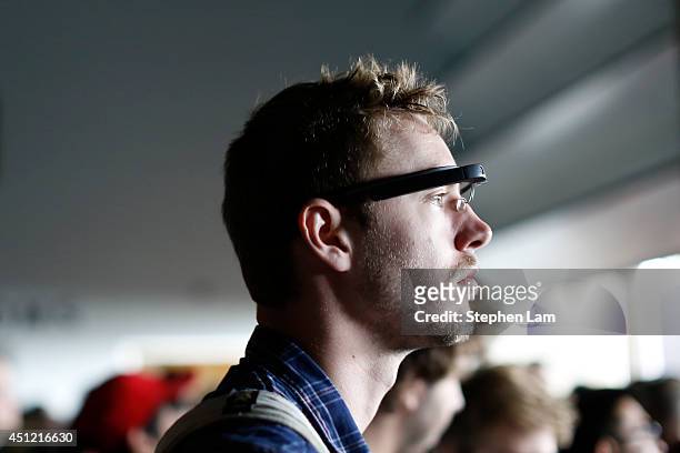 An attendee wears a Google Glass during the Google I/O Developers Conference at Moscone Center on June 25, 2014 in San Francisco, California. The...