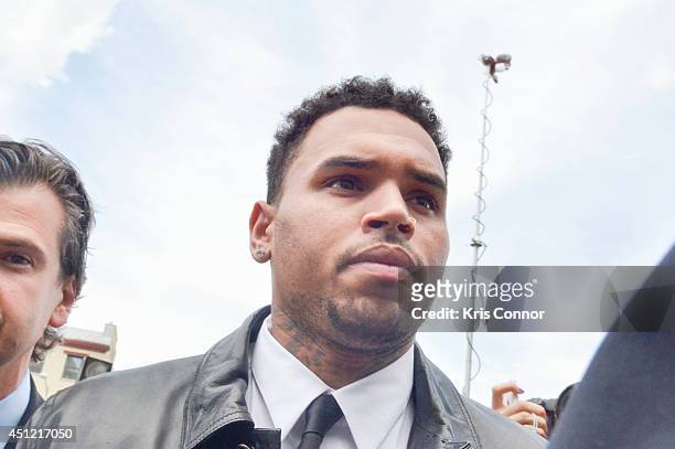 Chris Brown enters the H. Carl Moultrie I Court House of the District of Columbia where he is rejecting a plea deal for a October 28, 2013 assault...