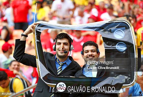 Fans pose prior to the 2014 FIFA World Cup Brazil Group E match between Honduras and Switzerland at Arena Amazonia on June 25, 2014 in Manaus, Brazil.