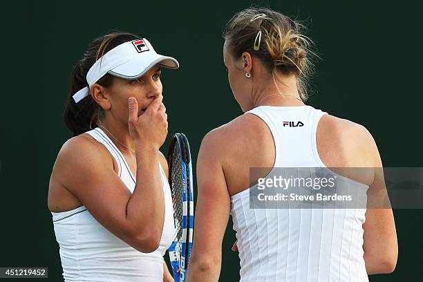Chanelle Scheepers of South Africa and Vera Dushevina of Russia during their Ladies Doubles first round match against Annika Beck of Germany and...