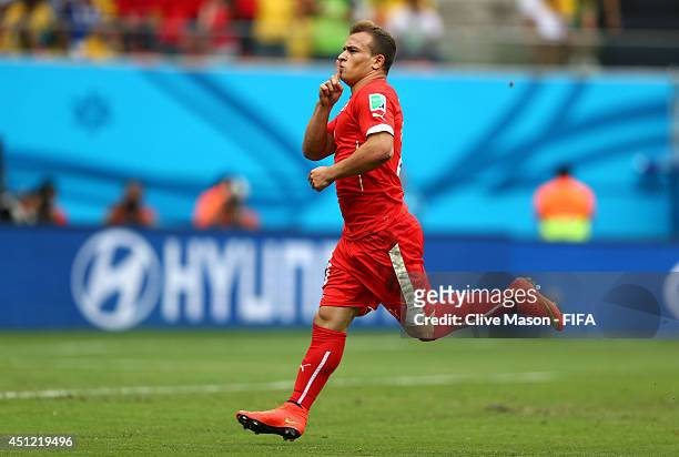 Xherdan Shaqiri of Switzerland celebrates scoring his team's first goal during the 2014 FIFA World Cup Brazil Group E match between Honduras and...
