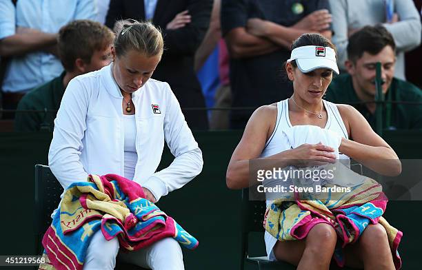 Vera Dushevina of Russia and Chanelle Scheepers of South Africa during their Ladies Doubles first round match against Annika Beck of Germany and...