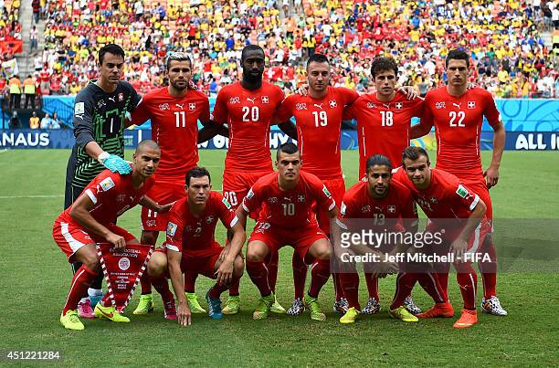 Switzerland players line up for the team photos prior to the 2014 FIFA World Cup Brazil Group E match between Honduras and Switzerland at Arena...
