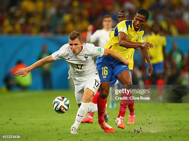 Lucas Digne of France is challenged by Antonio Valencia of Ecuador during the 2014 FIFA World Cup Brazil Group E match between Ecuador and France at...
