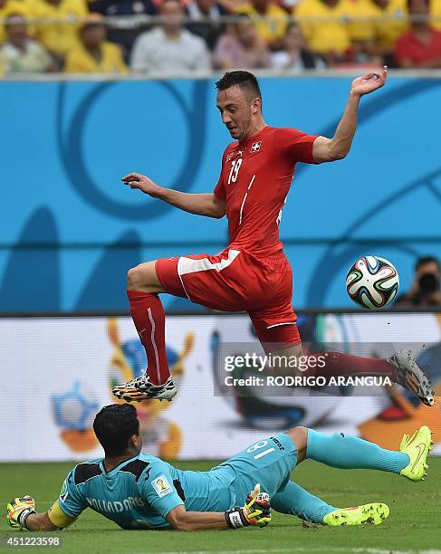 Honduras' goalkeeper Noel Valladares blocks a shot on goal by Switzerland's forward Josip Drmic during the Group E football match between Honduras...