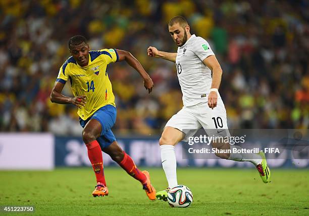 Karim Benzema of France and Oswaldo Minda of Ecuador compete for the ball during the 2014 FIFA World Cup Brazil Group E match between Ecuador and...