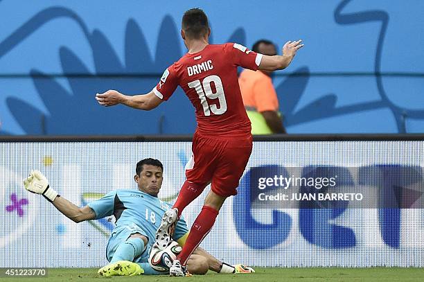 Honduras' goalkeeper Noel Valladares blocks a shot on goal by Switzerland's forward Josip Drmic during the Group E football match between Honduras...