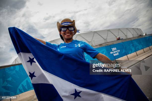 An Honduran fan poses outside the Amazonia Arena in Manaus, Brazil, before the start of the FIFA World Cup Group E football match between Honduras...