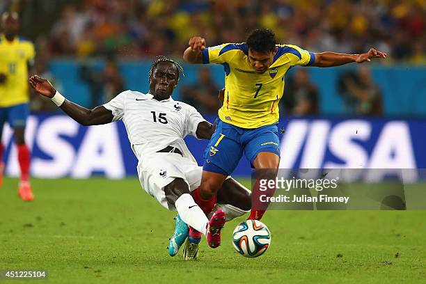 Bacary Sagna of France tackles Jefferson Montero of Ecuador during the 2014 FIFA World Cup Brazil Group E match between Ecuador and France at...