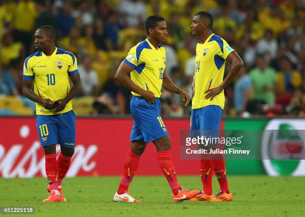 Antonio Valencia of Ecuador is sent off with a red card as teammates Walter Ayovi and Oswaldo Minda look on during the 2014 FIFA World Cup Brazil...
