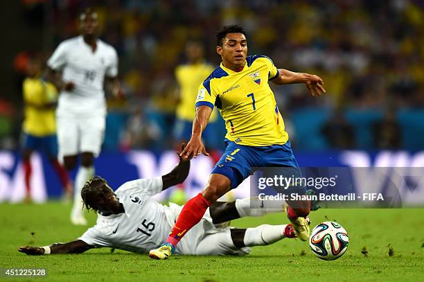 Jefferson Montero of Ecuador is tackled by Bacary Sagna of France during the 2014 FIFA World Cup Brazil Group E match between Ecuador and France at...