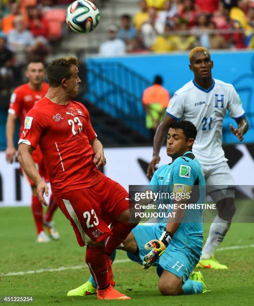 Switzerland's midfielder Xherdan Shaqiri vies with Honduras' goalkeeper and captain Noel Valladares during a Group E football match between Honduras...