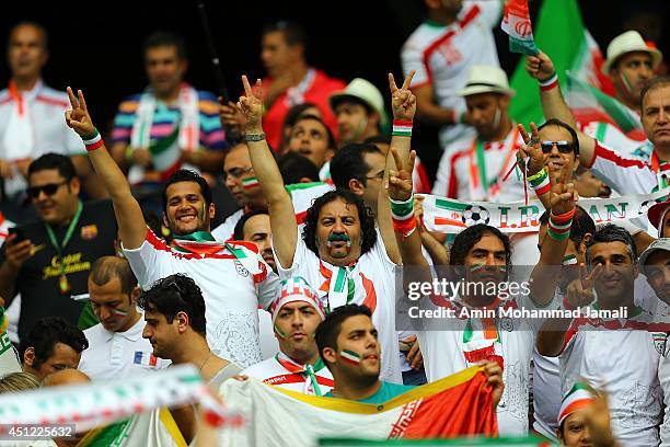 Iranian Artists Pejman Jamshidi and Merab Ghasem Khani and Siavash Kheyrabi and Reza Yazdani look on during the 2014 FIFA World Cup Brazil Group F...