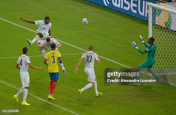 Paul Pogba of France heads the ball wide of the goal past Alexander Dominguez of Ecuador during the 2014 FIFA World Cup Brazil Group E match between...
