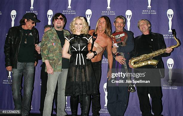 Inductee Madonna poses with Scott Asheton, Ron Asheton, Iggy Pop, Mike Watt and Steve MacKay of The Stooges in the press room during the 23rd Annual...