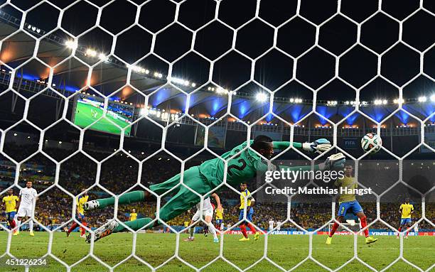 Alexander Dominguez of Ecuador makes a save on a shot by Loic Remy of France during the 2014 FIFA World Cup Brazil Group E match between Ecuador and...