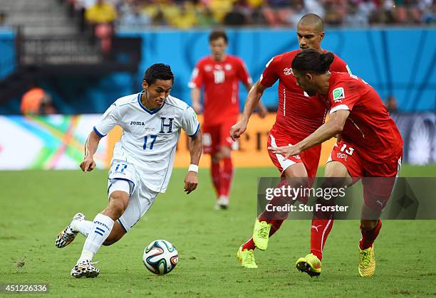 Andy Najar of Honduras controsl the ball as Ricardo Rodriguez of Switzerland gives chase during the 2014 FIFA World Cup Brazil Group E match between...