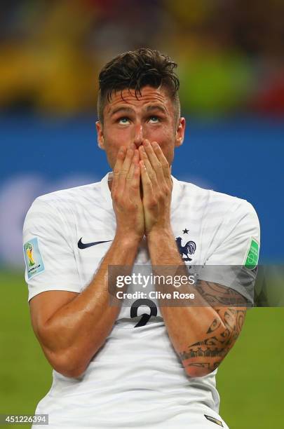 Olivier Giroud of France reacts after a missed chance during the 2014 FIFA World Cup Brazil Group E match between Ecuador and France at Maracana on...