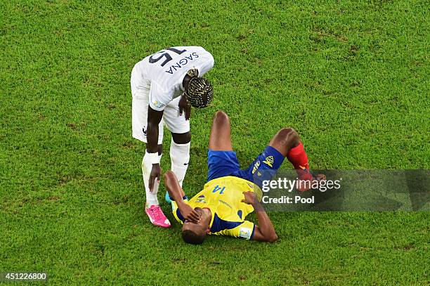 Oswaldo Minda of Ecuador is consoled by Bacary Sagna of France after a 0-0 draw during the 2014 FIFA World Cup Brazil Group E match between Ecuador...