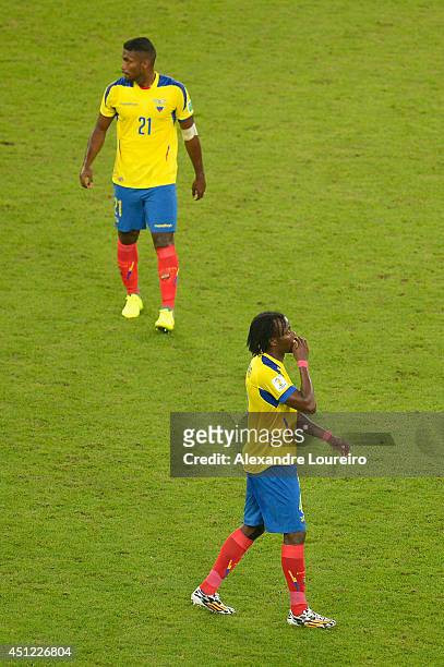 Gabriel Achilier and Juan Carlos Paredes of Ecuador react after a 0-0 draw during the 2014 FIFA World Cup Brazil Group E match between Ecuador and...