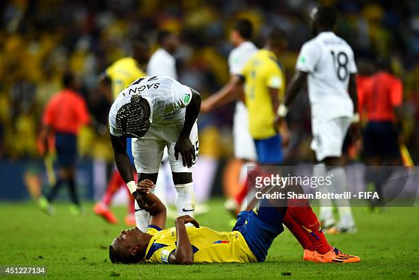 Oswaldo Minda of Ecuador is consoled by Bacary Sagna of France after the 2014 FIFA World Cup Brazil Group E match between Ecuador and France at...