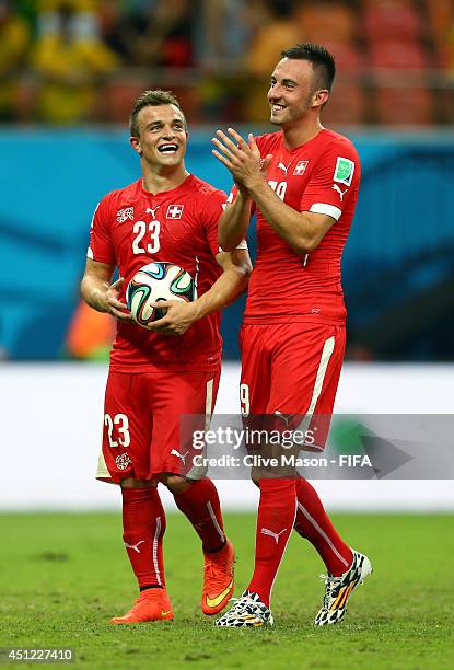 Xherdan Shaqiri and Josip Drmic of Switzerland celebrate after the 3-0 win in the 2014 FIFA World Cup Brazil Group E match between Honduras and...