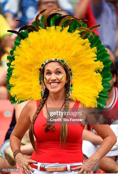 Fan poses with a headdress during the 2014 FIFA World Cup Brazil Group E match between Honduras and Switzerland at Arena Amazonia on June 25, 2014 in...
